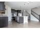 Modern kitchen with stainless steel appliances, a large island, and hardwood floors at 8791 Culebra Ct, Arvada, CO 80007