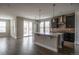 Modern kitchen featuring stainless steel appliances, a large island, and an open floor plan at 8791 Culebra Ct, Arvada, CO 80007