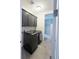 Convenient laundry room with modern washer and dryer units and storage cabinets at 8791 Culebra Ct, Arvada, CO 80007