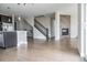 Open-concept living room with hardwood floors, fireplace, and staircase at 8791 Culebra Ct, Arvada, CO 80007