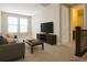 Upstairs living room features comfortable seating, a TV, and lots of light at 8791 Culebra Ct, Arvada, CO 80007