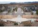 Elevated view of neighborhood homes and street leading to a scenic mountain backdrop at 8791 Culebra Ct, Arvada, CO 80007