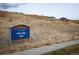 Westridge Park signage next to a sidewalk in a grassy community park area at 8791 Culebra Ct, Arvada, CO 80007