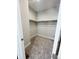 A walk-in closet featuring carpeted floors and ample shelf space at 8791 Culebra Ct, Arvada, CO 80007
