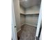 Empty walk-in closet featuring carpet flooring and shelving at 8791 Culebra Ct, Arvada, CO 80007