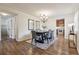 Elegant dining room with stylish chandelier, seamlessly connecting to the kitchen at 6903 E Girard Ave # A, Denver, CO 80224