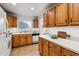 Well-lit kitchen with ample counter space and classic wood cabinetry, perfect for cooking and entertaining at 6903 E Girard Ave # A, Denver, CO 80224