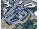 Aerial view of a residential community featuring multiple buildings, parking areas, and green spaces at 7665 E Eastman Ave # 301A, Denver, CO 80231