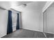 Cozy bedroom with large window and closet, featuring modern gray carpet at 7665 E Eastman Ave # 301A, Denver, CO 80231