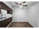Dining room with hardwood floors, a ceiling fan, and a view to the kitchen at 7665 E Eastman Ave # 301A, Denver, CO 80231