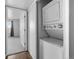 Convenient stackable washer and dryer units in a closet near the bedroom entrance at 7665 E Eastman Ave # 301A, Denver, CO 80231