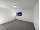 Minimalist bedroom with plush gray carpeting and neutral paint at 11813 Grant St, Northglenn, CO 80233