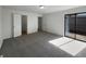 Neutral bedroom featuring an access door to a balcony and soft carpeting at 11813 Grant St, Northglenn, CO 80233