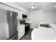 Modern kitchen with stainless steel appliances and white cabinets at 11813 Grant St, Northglenn, CO 80233