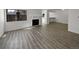 Inviting living room featuring wood floors and a charming fireplace at 11813 Grant St, Northglenn, CO 80233