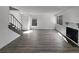 Spacious living room featuring hardwood floors, a fireplace, and natural light from large windows at 11813 Grant St, Northglenn, CO 80233