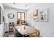 Light filled dining room featuring a wood table, four chairs and a window at 26288 S End Rd, Kittredge, CO 80457