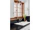 Close up of a kitchen sink featuring bright sunlight and a flower vase on the counter at 26288 S End Rd, Kittredge, CO 80457