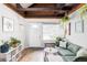 Bright and airy living room with hardwood floors, comfortable seating, and abundant natural light at 26288 S End Rd, Kittredge, CO 80457