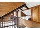 Unique loft area featuring wooden beams, built in bed and a view at 26288 S End Rd, Kittredge, CO 80457