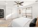 Bright bedroom with large window, closet, and in-unit laundry at 5360 Allison St # D, Arvada, CO 80002