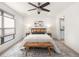 Spacious bedroom with ceiling fan, large windows, and en-suite bathroom at 5360 Allison St # D, Arvada, CO 80002