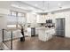 Modern kitchen with island and stainless steel appliances at 5360 Allison St # D, Arvada, CO 80002