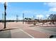 Brick paved plaza with streetlights, landscaping, and a transit stop at 5360 Allison St # D, Arvada, CO 80002
