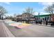 Outdoor scene showcasing shops and restaurants with colorful street art at 5360 Allison St # D, Arvada, CO 80002