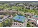 Aerial view of tennis courts, community buildings, and green spaces at 14390 E Marina Dr # 606, Aurora, CO 80014