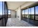 Balcony with glass, tile flooring, and sliding glass door to a bright outdoor view at 14390 E Marina Dr # 606, Aurora, CO 80014