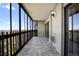Outdoor balcony features tile flooring, glass windows and great views of the treeline at 14390 E Marina Dr # 606, Aurora, CO 80014