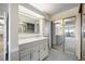 Bright, clean bathroom with dual sinks, modern vanity, mirrored closet doors for ample storage at 14390 E Marina Dr # 606, Aurora, CO 80014