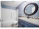 Well-maintained bathroom with modern fixtures, vanity, and a tub-shower combination with blue paint at 14390 E Marina Dr # 606, Aurora, CO 80014