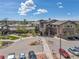 Well-maintained building exterior with beautiful landscaping, a roundabout entrance and ample parking at 14390 E Marina Dr # 606, Aurora, CO 80014