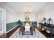 Elegant dining room showcasing a modern chandelier and a dining table with seating for eight at 14390 E Marina Dr # 606, Aurora, CO 80014