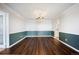 Bright dining room featuring hardwood floors and stylish two-tone wall decor at 14390 E Marina Dr # 606, Aurora, CO 80014