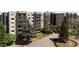 A view of the exterior showcasing the condo's balcony and mature landscaping at 14390 E Marina Dr # 606, Aurora, CO 80014