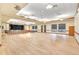 A spacious hall area featuring a stage, wood floors, and neutral wall colors at 14390 E Marina Dr # 606, Aurora, CO 80014
