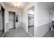 Hallway leading to bright bathroom featuring sliding mirror door on left at 14390 E Marina Dr # 606, Aurora, CO 80014