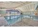Bright indoor pool area with large windows, multiple lanes, and ample deck space at 14390 E Marina Dr # 606, Aurora, CO 80014