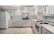 Bright kitchen with tiled floors, white cabinets and appliances, and a sleek black faucet at 14390 E Marina Dr # 606, Aurora, CO 80014