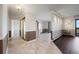 Spacious living area with combination tile and hardwood flooring, neutral walls and natural light at 14390 E Marina Dr # 606, Aurora, CO 80014