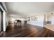 Spacious living room with hardwood floors, recessed lighting, and a pass-through to the kitchen at 14390 E Marina Dr # 606, Aurora, CO 80014