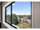 Expansive views visible from a large window overlooking the street and the treeline at 14390 E Marina Dr # 606, Aurora, CO 80014