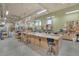 Features a large workshop area with tool benches, equipment, and natural lighting at 14390 E Marina Dr # 606, Aurora, CO 80014