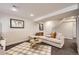 Finished basement with a comfortable sitting area at 4870 S Iris St, Littleton, CO 80123