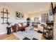 Living room with hardwood floors, neutral walls, and stylish furniture at 4870 S Iris St, Littleton, CO 80123