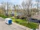 Aerial view of a home highlighting the yard, neighborhood and surrounding mature trees at 4433 S Washington St, Englewood, CO 80113