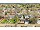 An aerial view of a home showing the layout of the yard and surrounding mature trees at 4433 S Washington St, Englewood, CO 80113